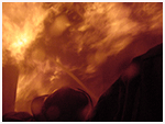 Flames filling a dark room